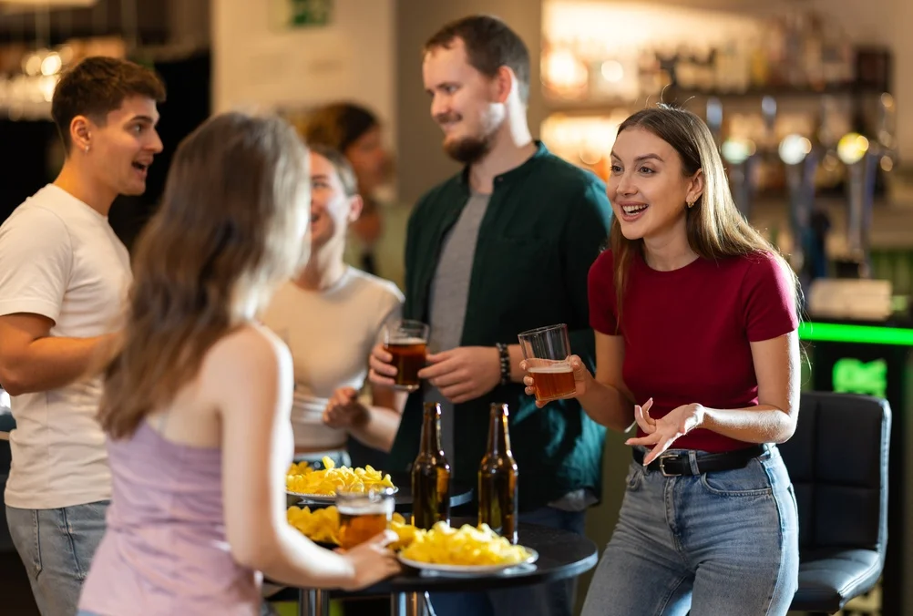 Group  of friends and fan having fun chatting and drinking beer
