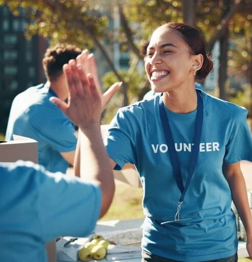 Nonprofit volunteers connecting during a community outreach event.