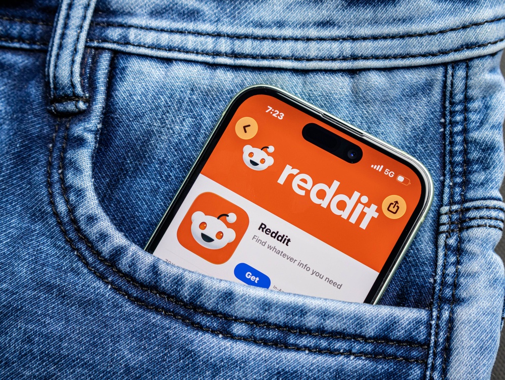 Smartphone with Reddit App Store Page Displayed